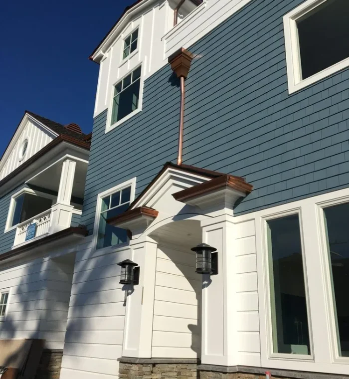new gutter system running off the side of the house