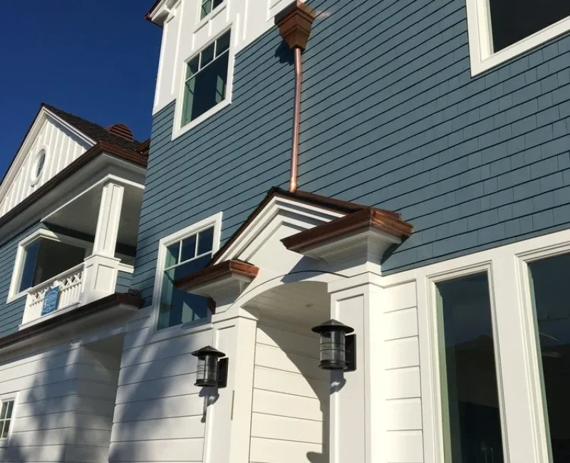 new gutter system running off the side of the house